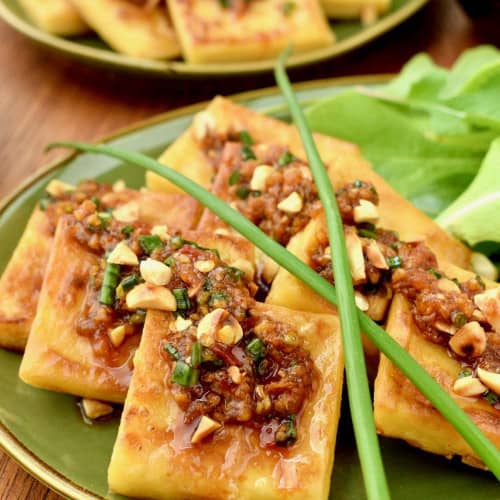 Burmese Tofu with Garlic Ginger Chili Sauce on a plate.