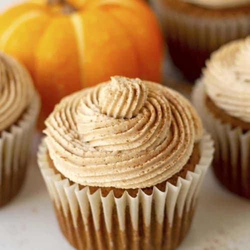 Vegan Gluten-Free Pumpkin Cupcakes in cupcake wrappers.