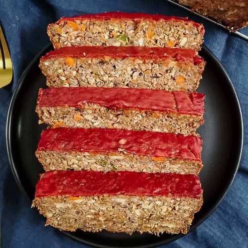 overhead of slices of lentil loaf on a plate.