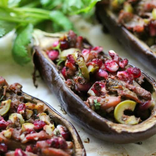 Close-up of Twice Baked Baby Eggplants on parchment paper.