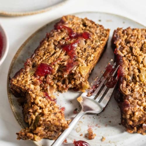 serving of nut roast on a plate with a fork.