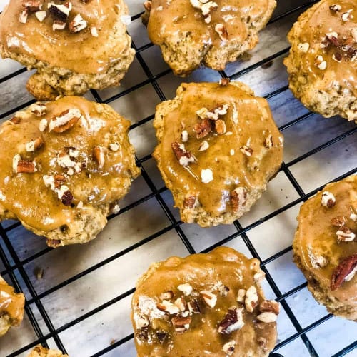 overhead of banana cookies on a cooling rack.