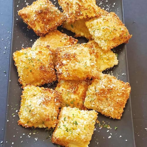 A platter of crispy air fryer raviolis.