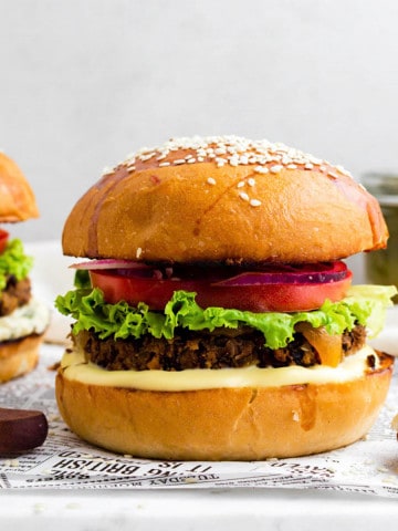 Chili's black bean burger placed on a marble board lined with parchment paper.