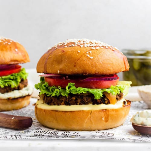 Chili's black bean burger placed on a marble board lined with parchment paper.