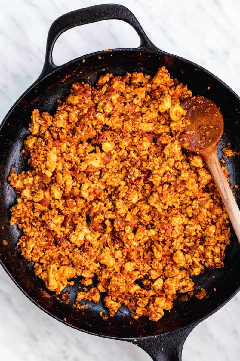 Cooking tofu sofritas in a cast-iron skillet.