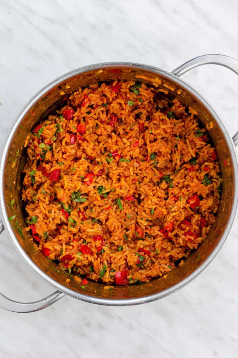 Vegan Mexican rice in a stainless-steel pot.