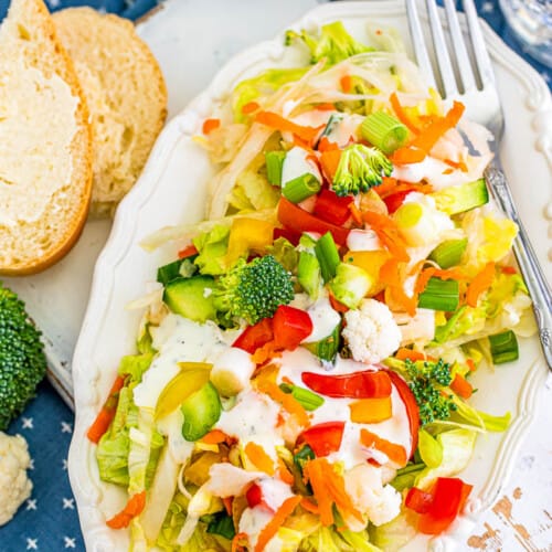 Chopped Vegetable Salad on a dish with a fork.