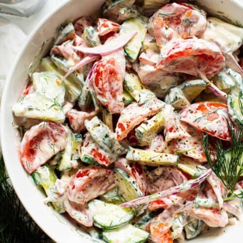 Creamy Cucumber Tomato Salad in a dish.