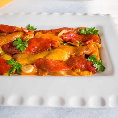 Roasted & Marinated Italian Peppers in a white dish.