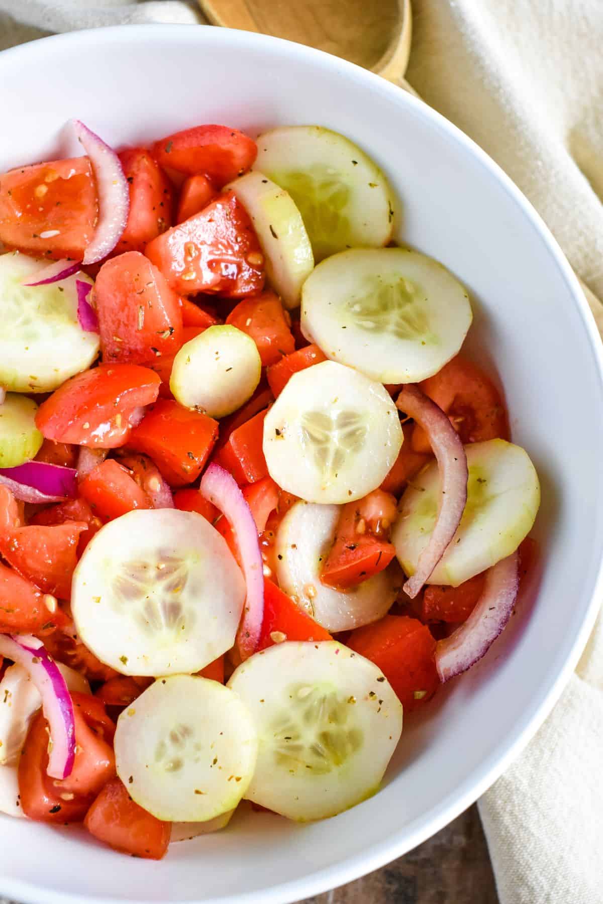 close-up of salad in a white bowl with part of left side off screen.