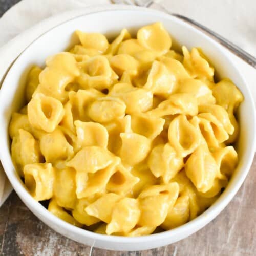 close-up overhead of mac and cheese in a white bowl.