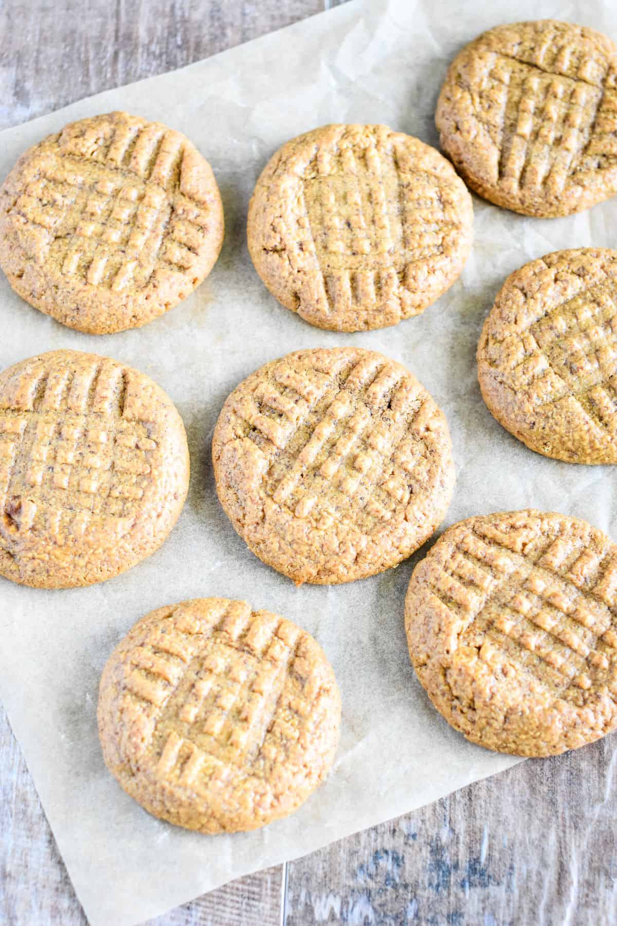 overhead of cookies spread around on parchment.