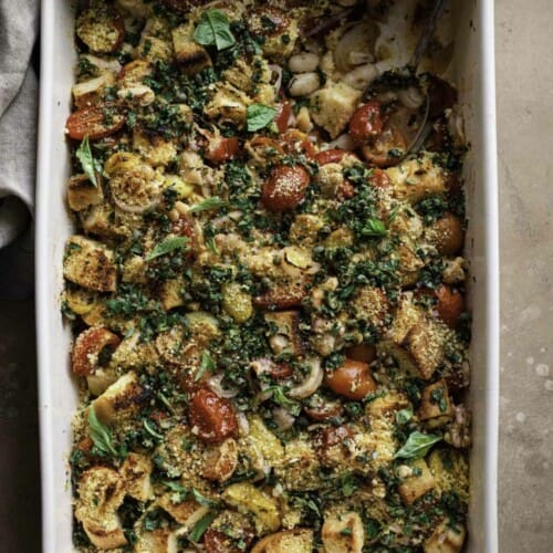 Tomato and white bean casserole with spoon dug in.