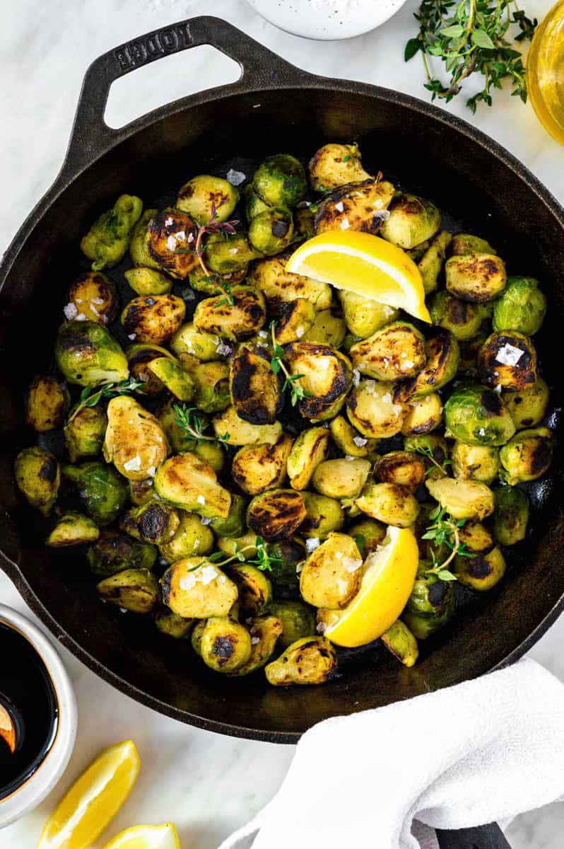 Frozen brussels sprouts cooked in a cast-iron skillet, and topped with flaky sea salt and fresh thyme.