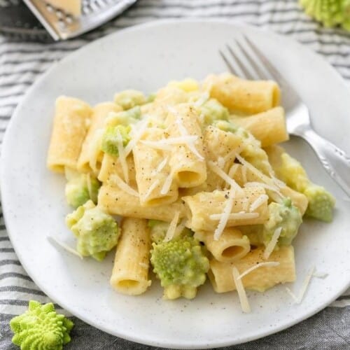 overhead of romanesco pasta on a white plate with a fork.