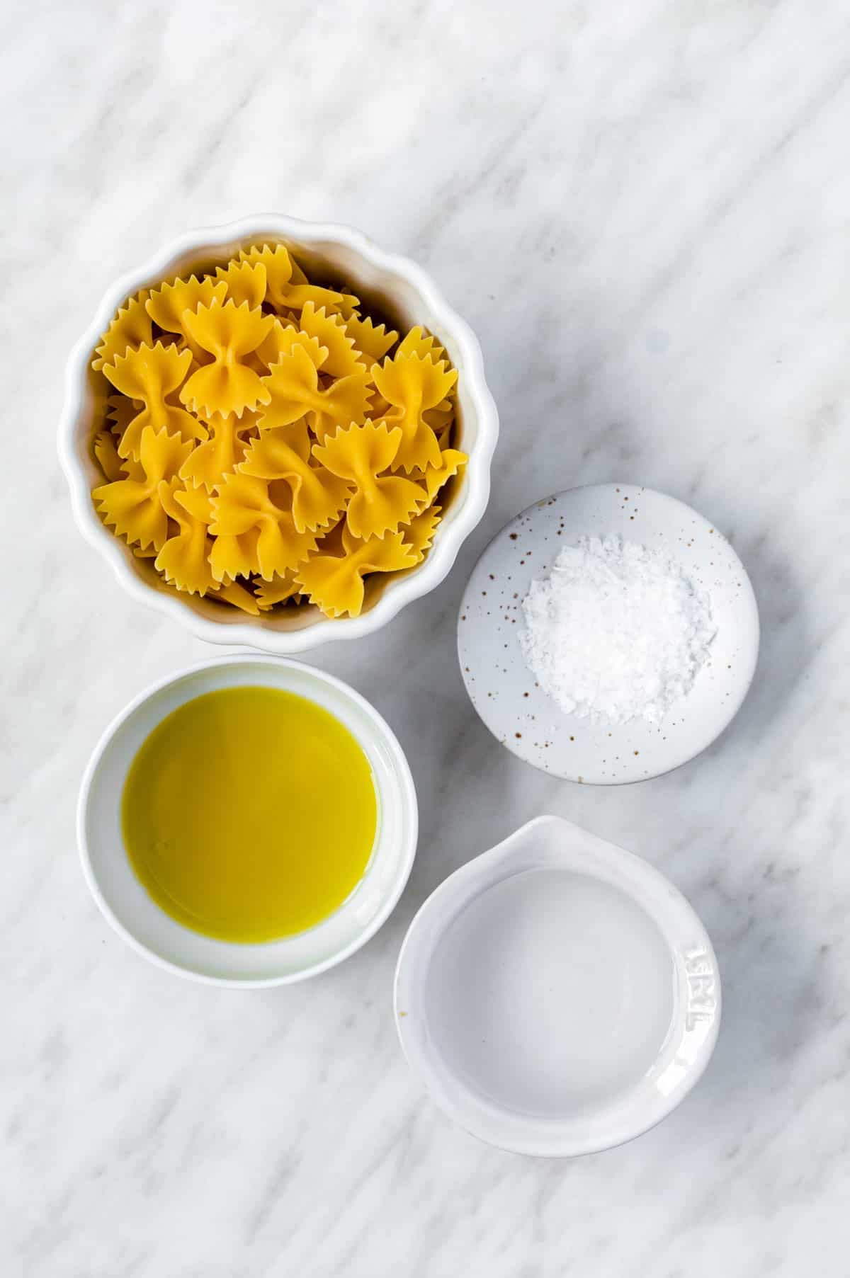 Gathered ingredients for cooking pasta in the microwave.