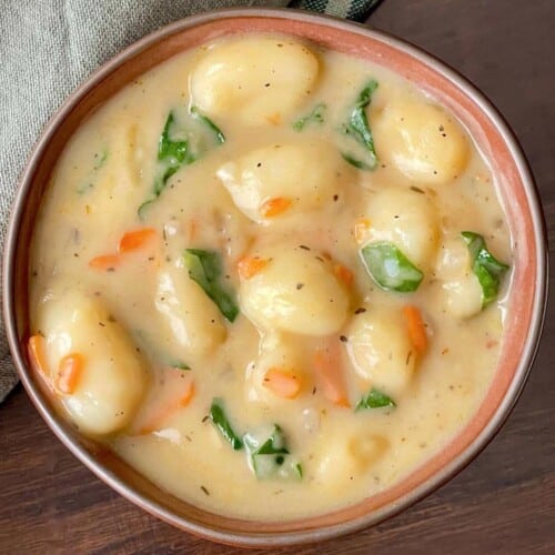 Vegan gnocchi soup served in a bowl.