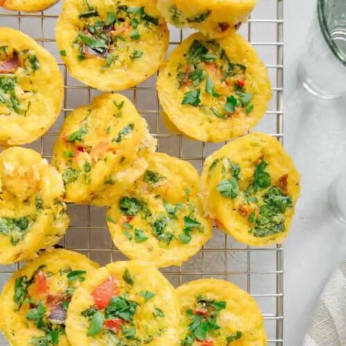 A bunch of egg bites on a cooling rack.