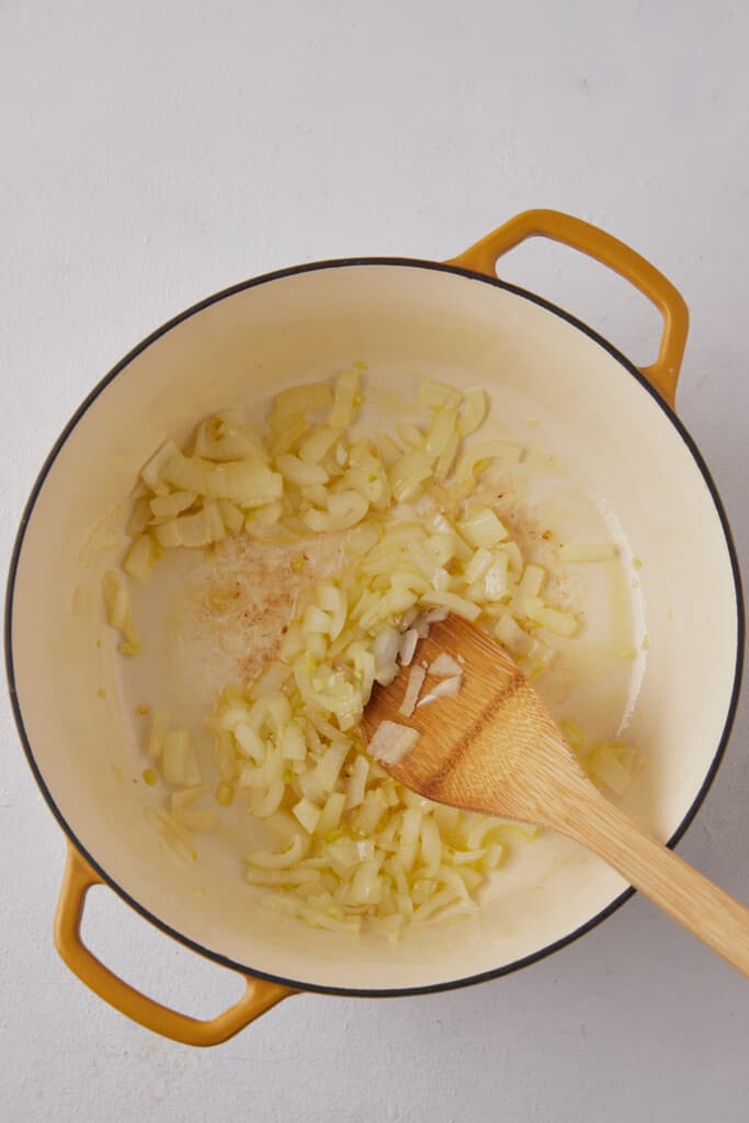 Soft onions in pot.