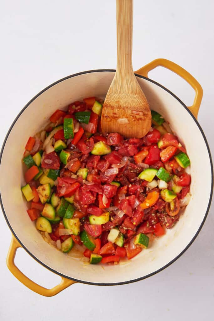 Cooked chopped veggies in pot.