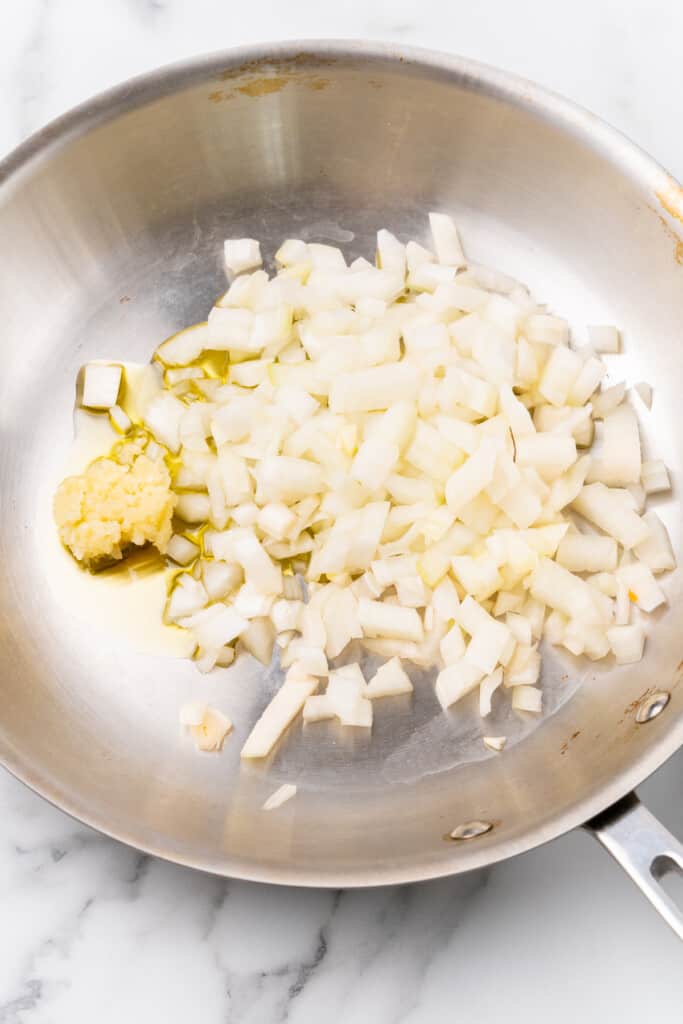 Onions and garlic in pan.