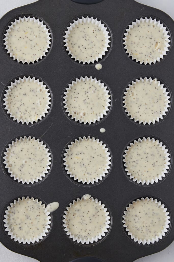 Muffin pan with lemon batter.