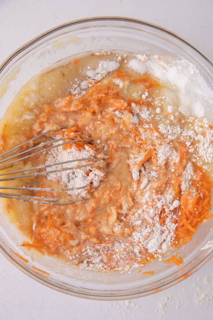 Flour and carrots in bowl.