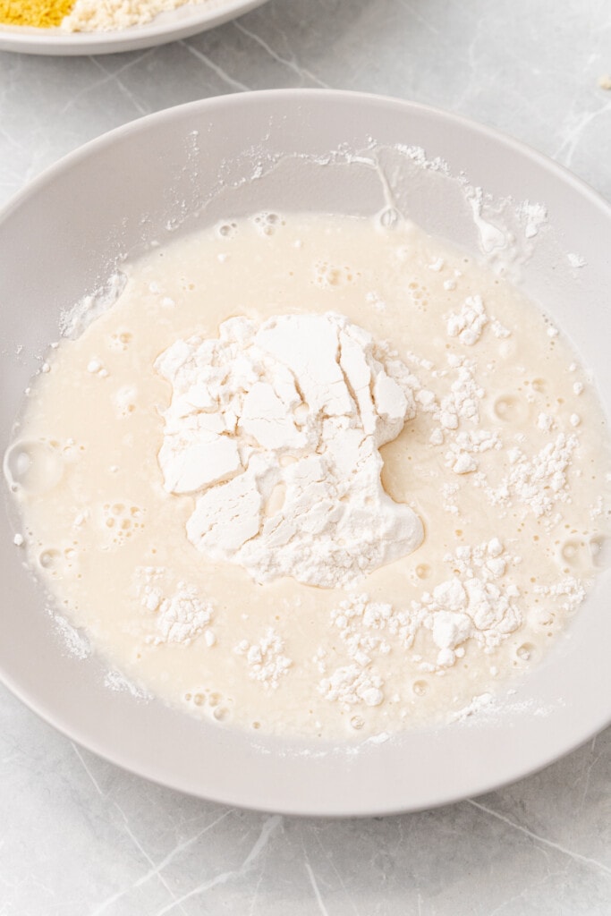 Flour with liquid in bowl.