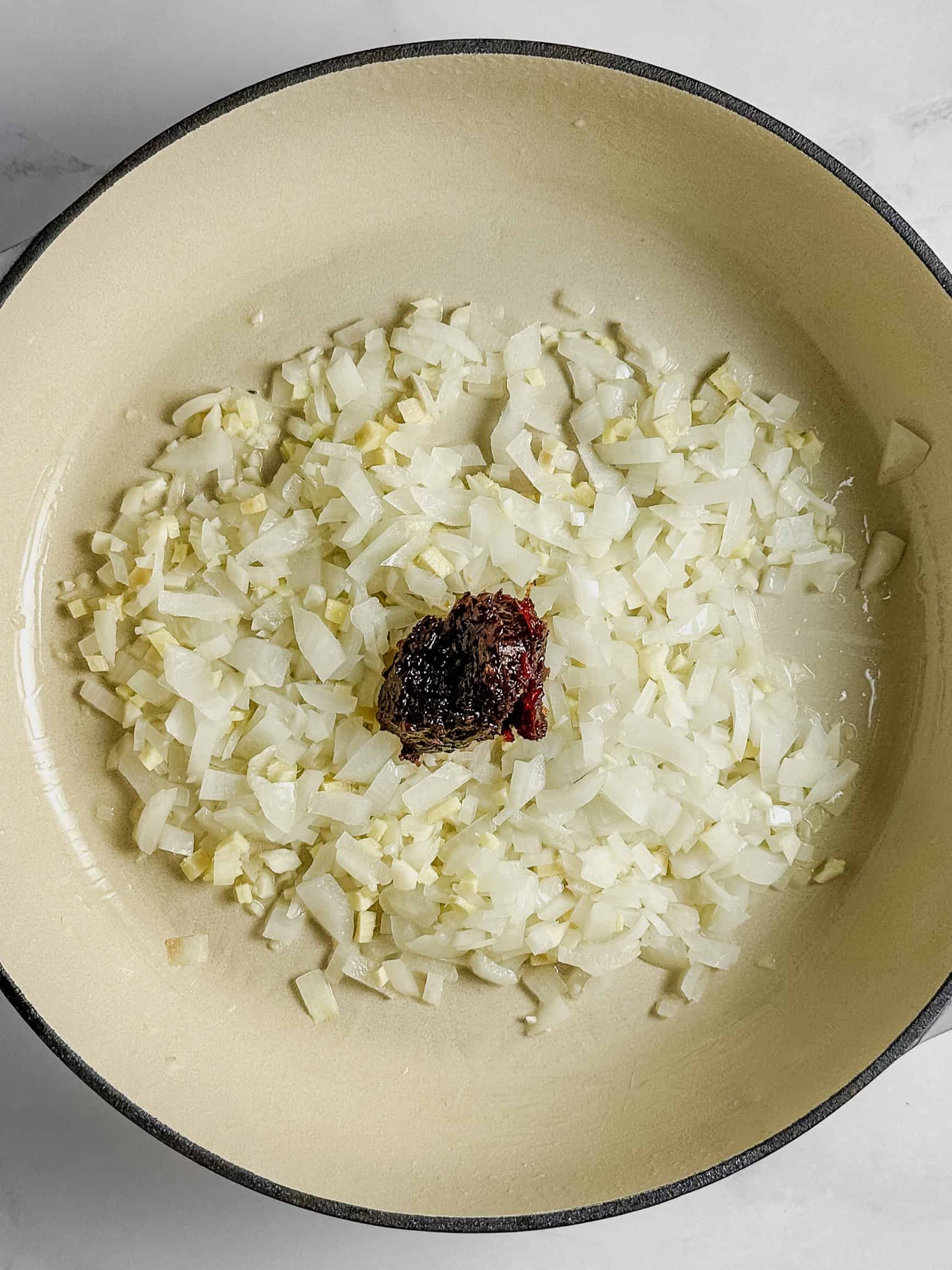 Diced onion in pan.