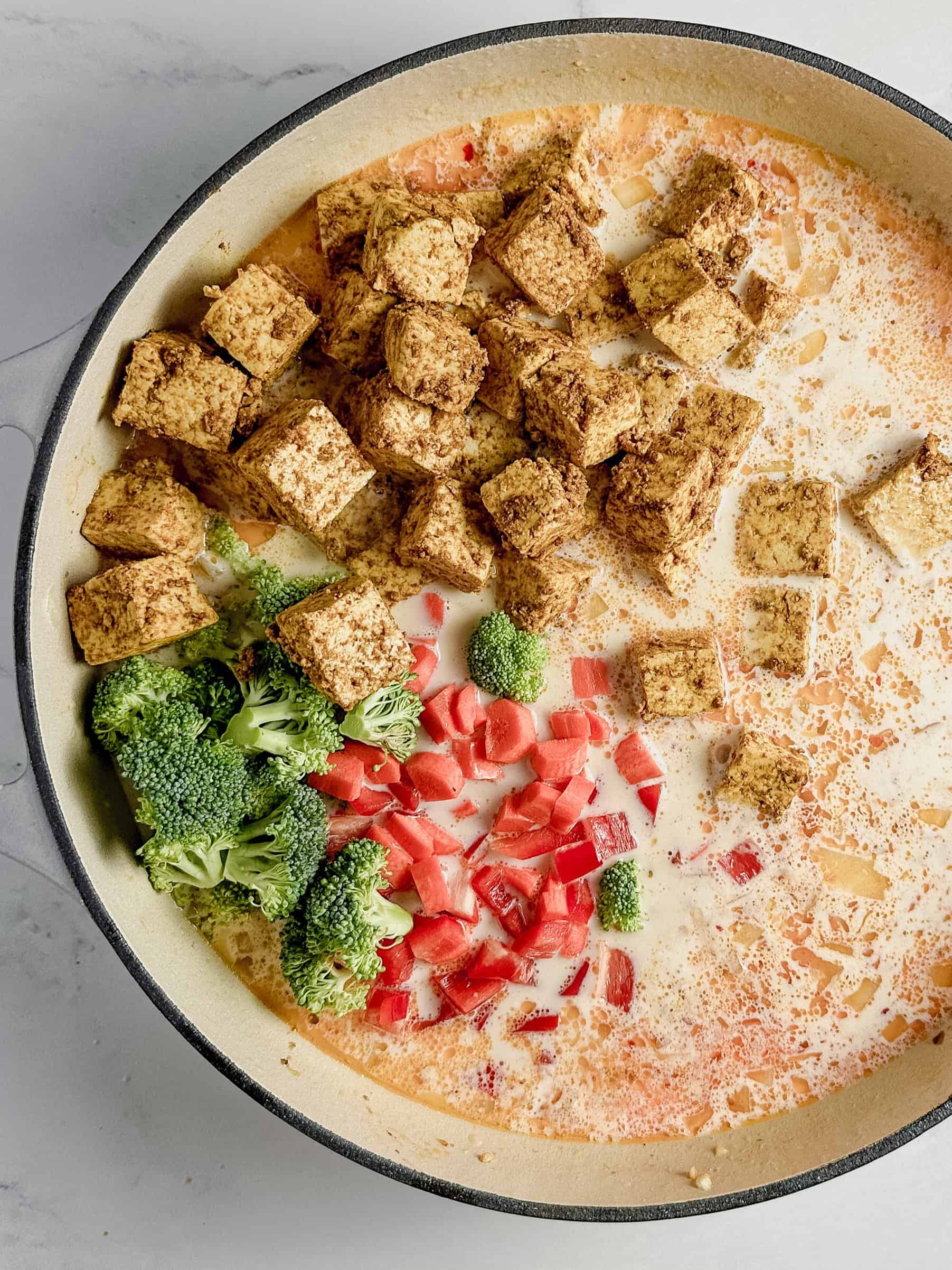 Tofu and veggies in skillet.