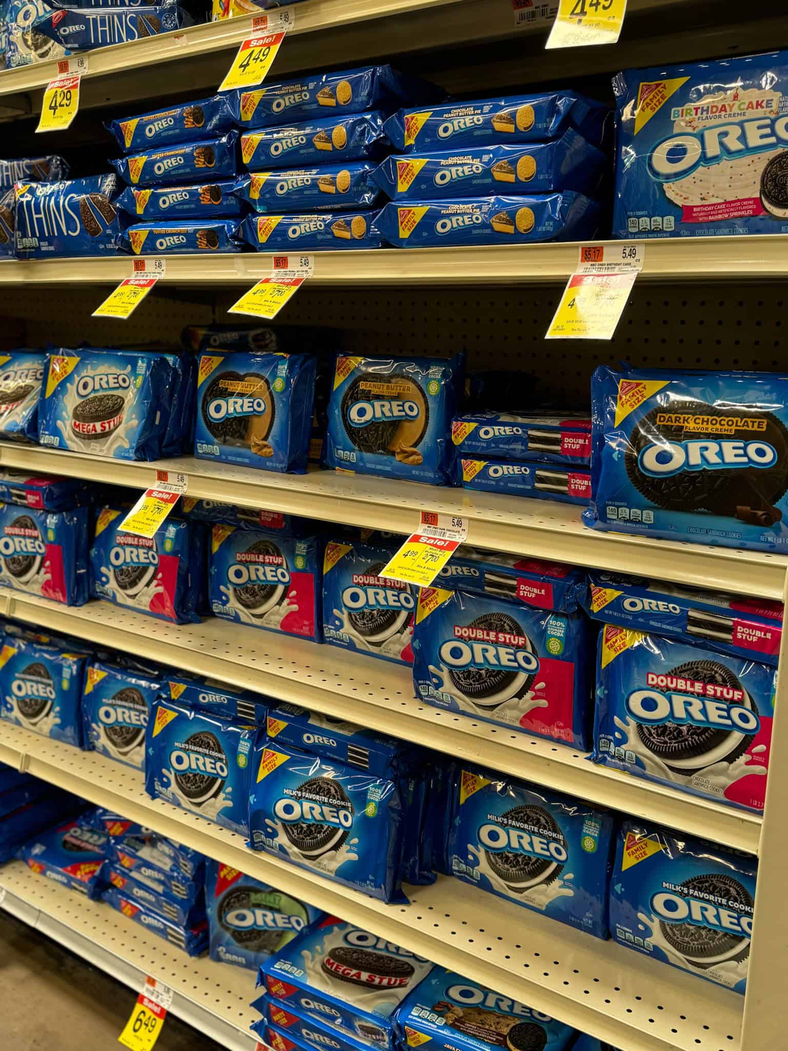 Different varieties of Oreos displayed at a grocery store aisle 