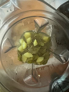 boiled cucumber and mint leaves in a blender