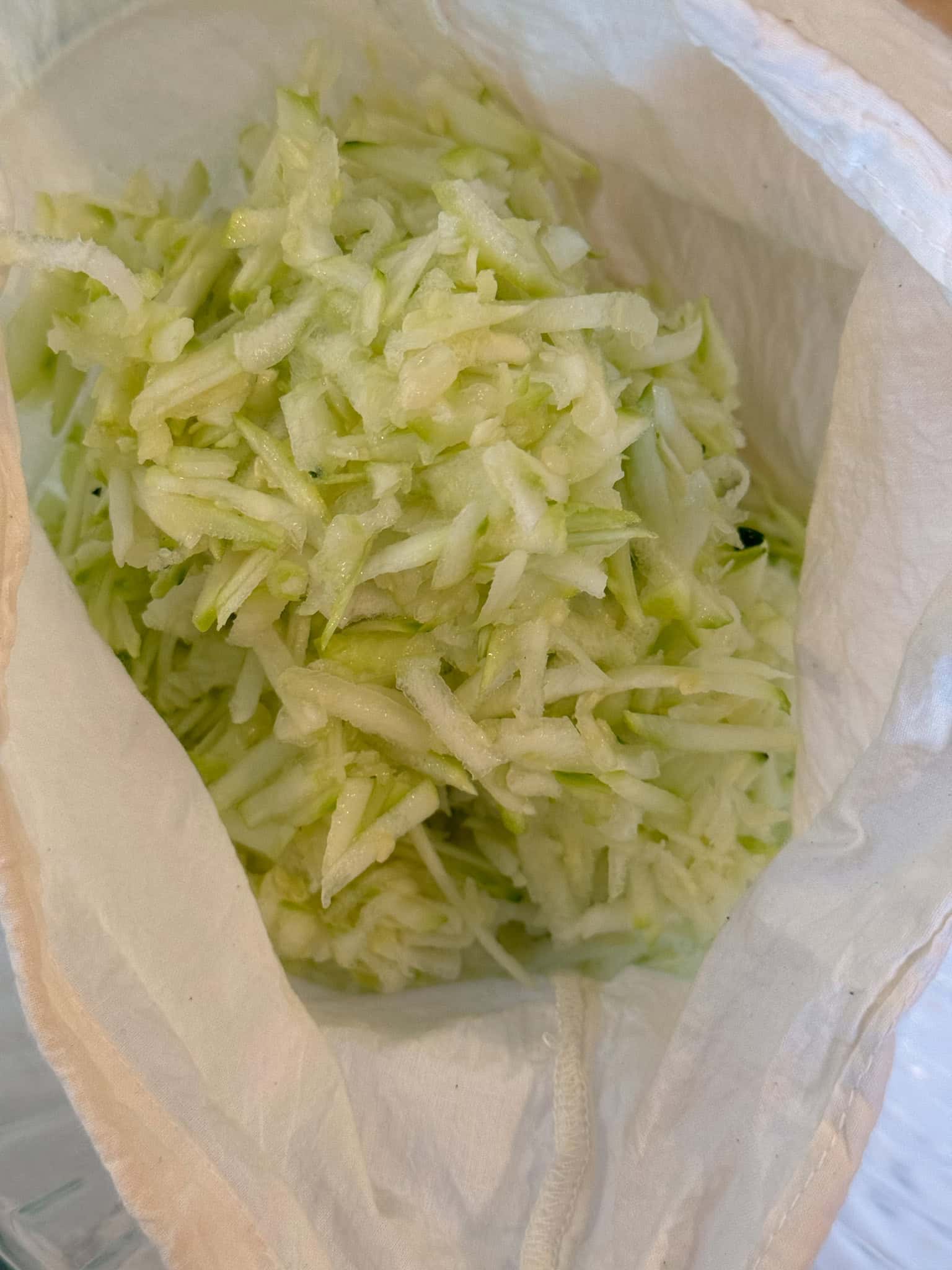 Shredded Zucchini in cheesecloth