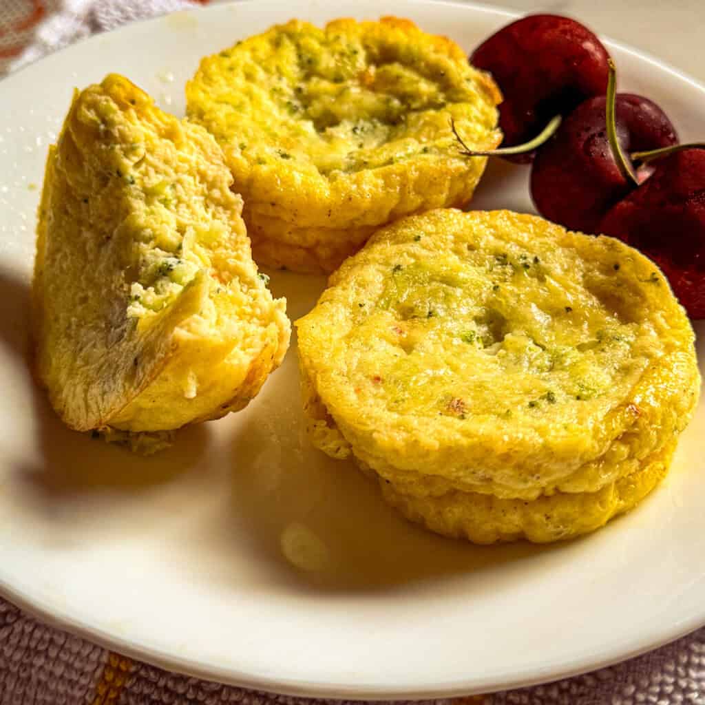 Plate of 3 cottage cheese egg bites served with 3 cherries